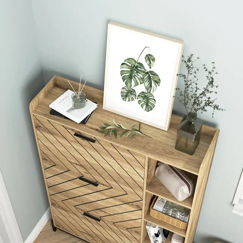 Meuble à chaussures moderne et compact avec 3 tiroirs basculants et des étagères ouvertes